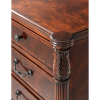 Close-up of carved details on mahogany dresser corner.