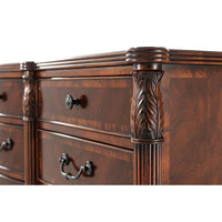 Detailed view of decorative carvings on mahogany dresser.