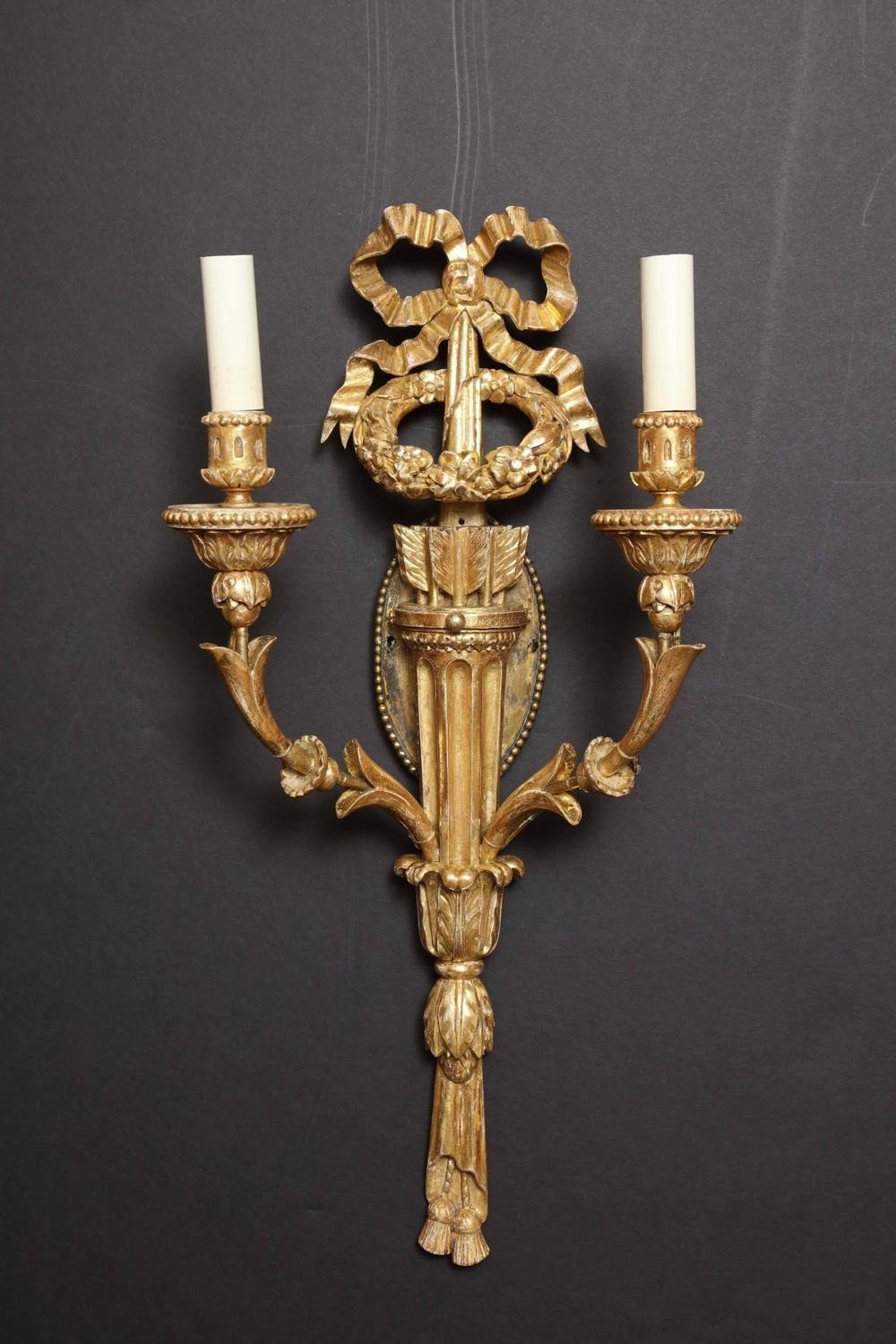 Single carved giltwood sconce with two candle holders.