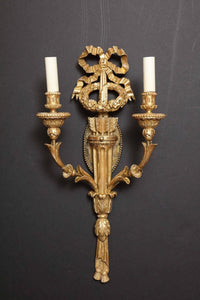 Single carved giltwood sconce with two candle holders.