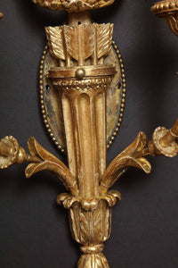 Middle section detail of giltwood sconce design.