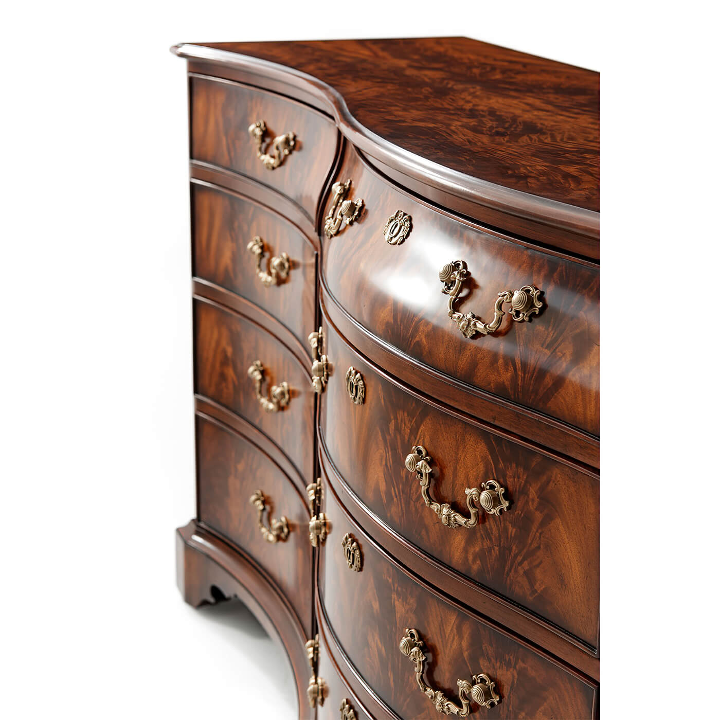 Close-up curved dresser drawers, ornate handles detail.