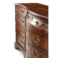 Close-up curved dresser drawers, ornate handles detail.