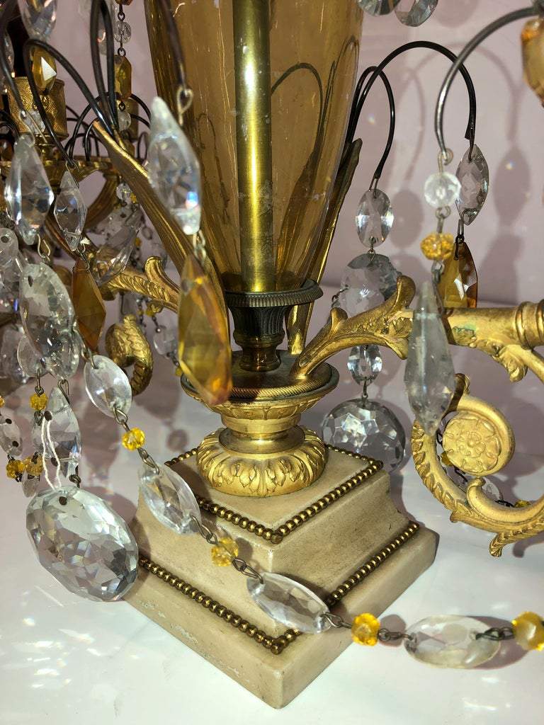 Base detail of Russian candelabra with intricate design.
