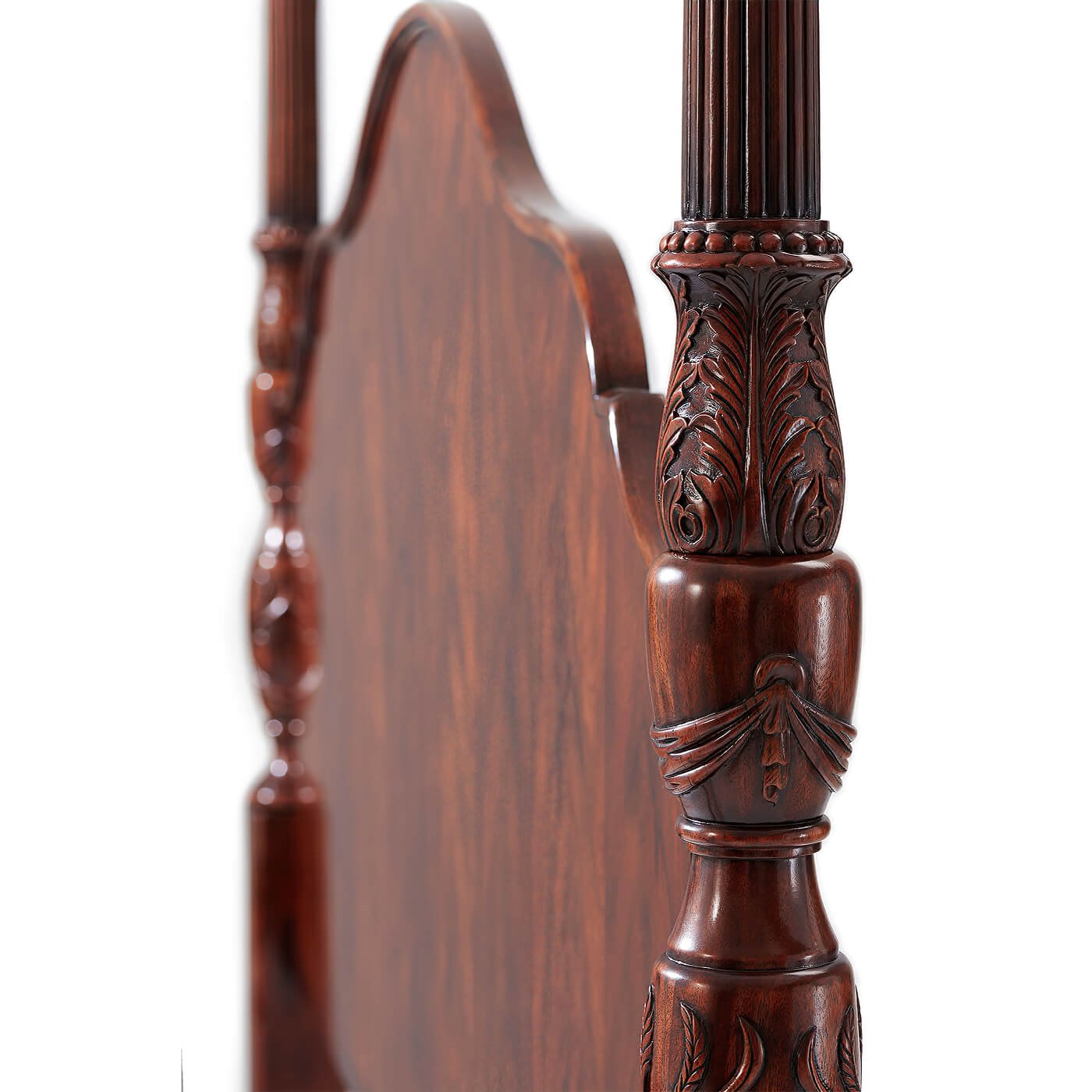 Detailed carving on mahogany four post bed.