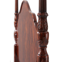 Detailed carving on mahogany four post bed.