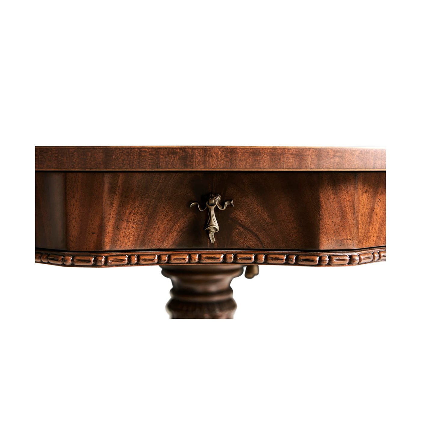 Drawer handle detail on mahogany center table.