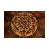 Close-up of intricate inlay on table top.
