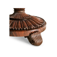 Carved base of finely inlaid center table.