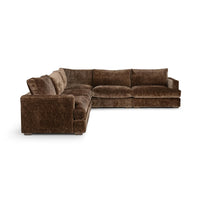 Angled view of brown corner sectional showing the outer arm and deep seat cushions