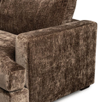 Close-up of the brown sectional outer arm showing its squared profile and fabric texture