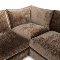 Close-up of brown sectional corner seat and adjoining back cushions