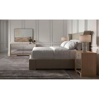 Bedroom scene with flared modern upholstered king bed.