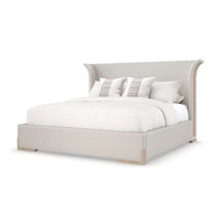 Flared modern upholstered bed angled view, king size.