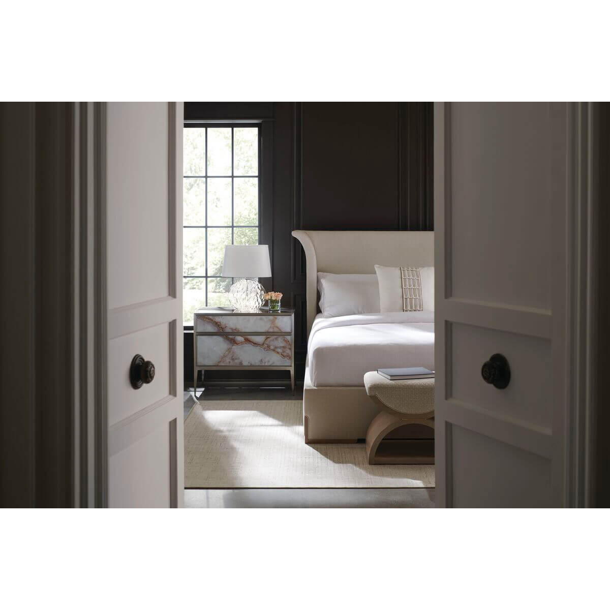 Bedroom showing flared modern bed with decor, king size.