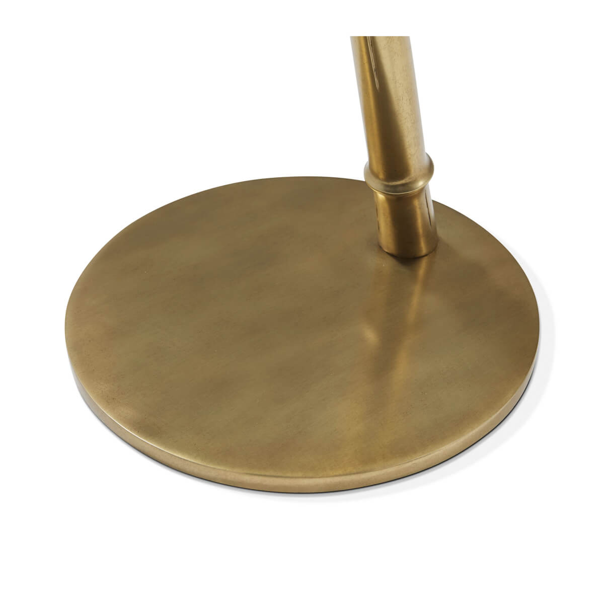 Close-up of floating burl accent table brass base.
