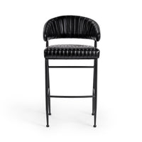 Front view of the fluted black leather bar stool with channel stitching across the back and seat