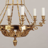 Close-up of chandelier arms and candle holders.