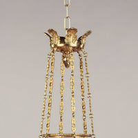 Chandelier top section with ornate gold chains.