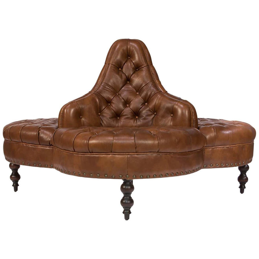 Three-sided brown leather lobby sofa, tufted design.