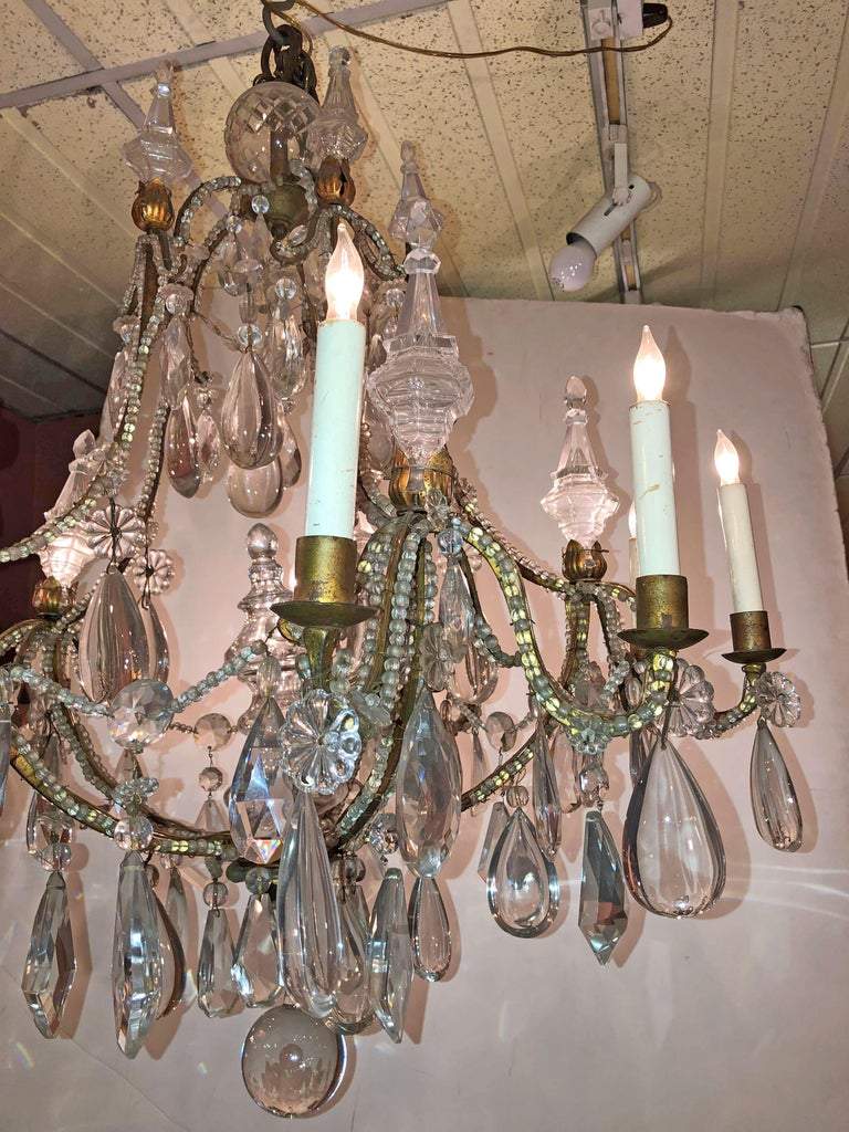 Side view of chandelier with ornate crystal drops.