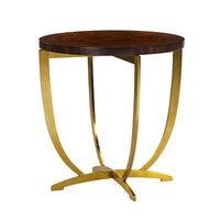 Round side table with gold curved legs, perspective view.