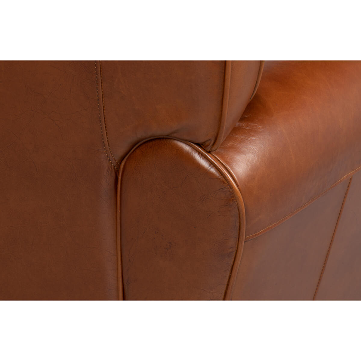 Armrest and side stitching detail on club chair.
