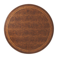 Top view of round wooden dining table with inlay design.