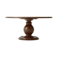 Side view of round dining table, pedestal base visible.
