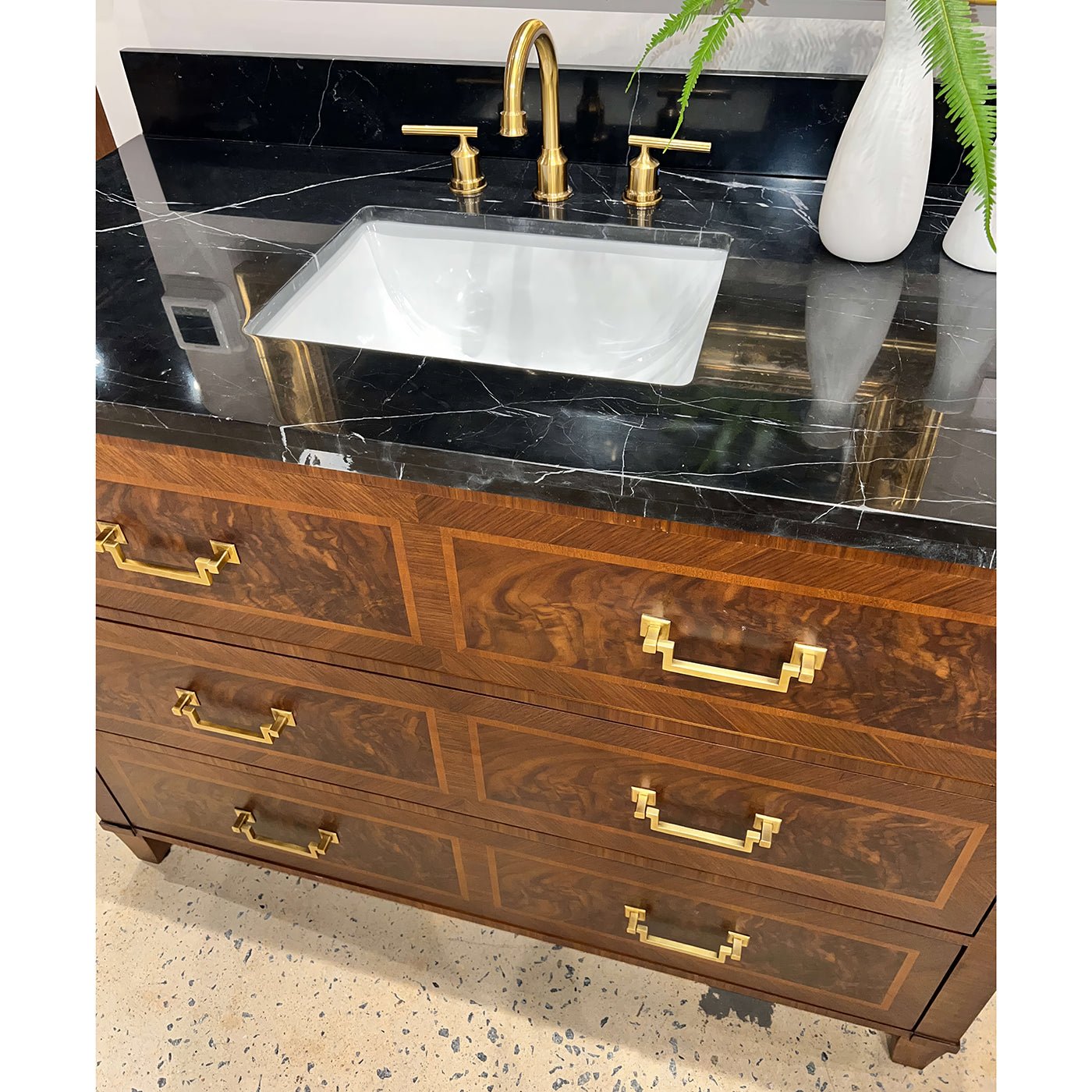 Top view vanity, focus on marble sink and handles.
