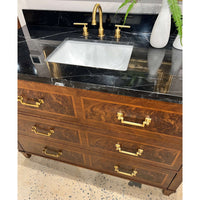 Top view vanity, focus on marble sink and handles.