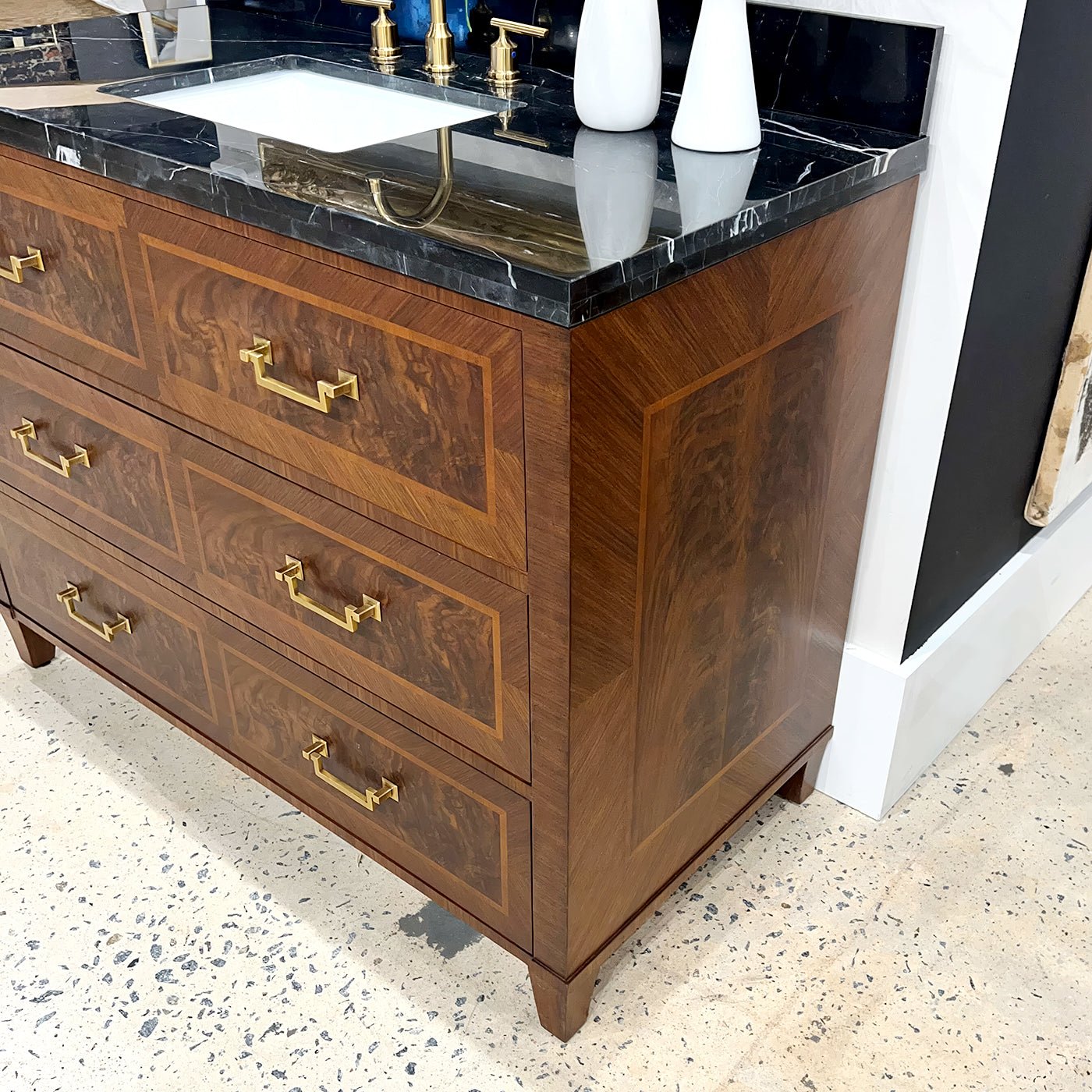 Side angle of vanity showcasing wood grain and hardware.