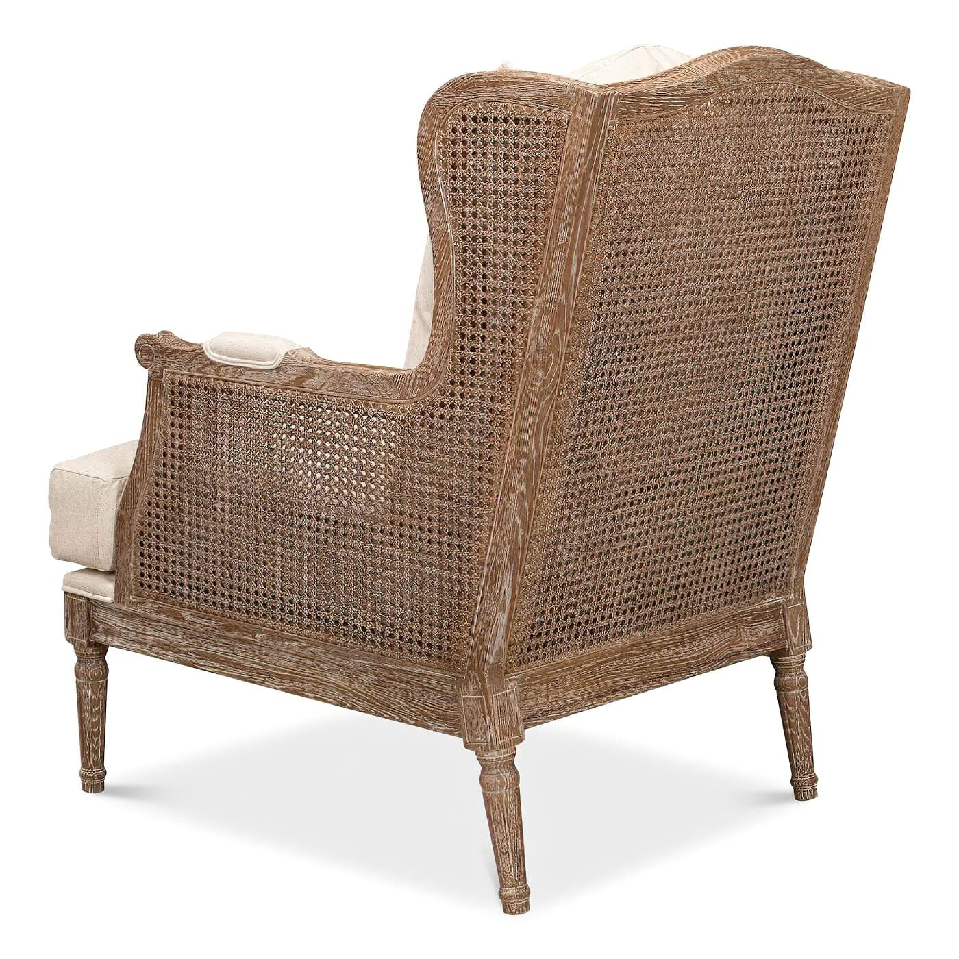 Rear angle highlighting cane work on French caned armchair.