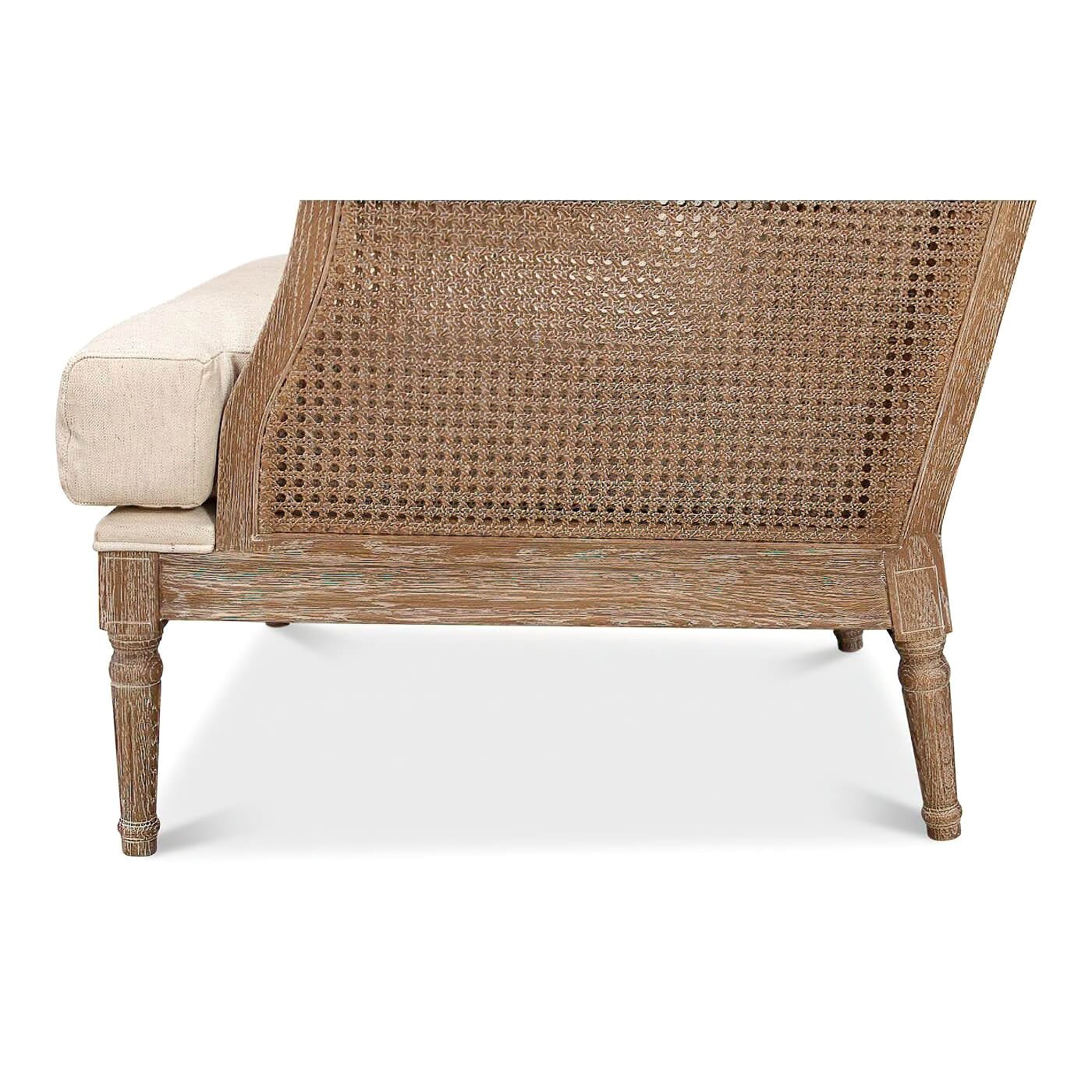 Side panel detailing on French caned armchair.