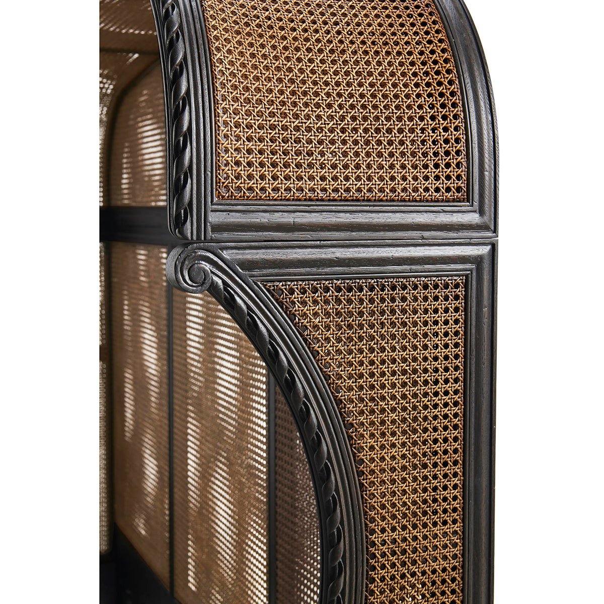 Close-up of French caned king bed headboard detail.