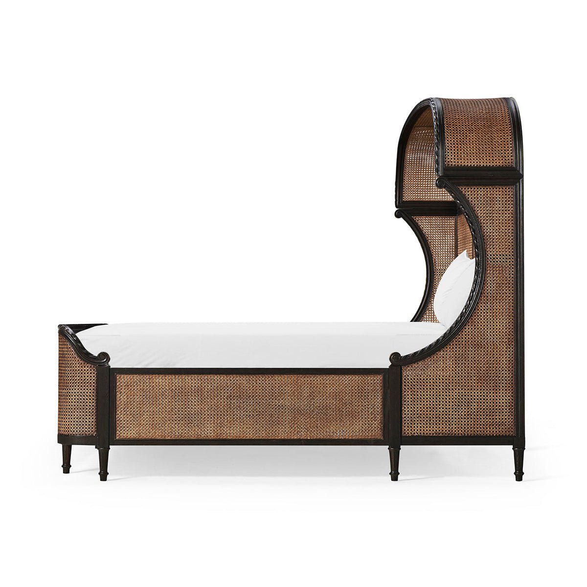 Side profile of French caned king bed with mattress.