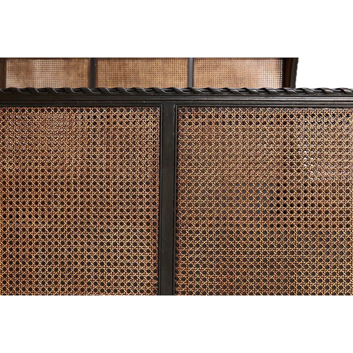Close-up of French caned king bed footboard design.