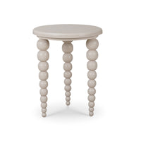 Beige round side table, beaded legs, front view.