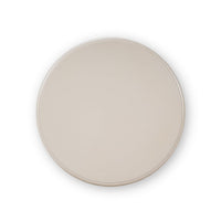 Beige round tabletop, accent table, top-down horizontal view.