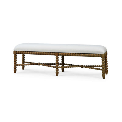 Side view of wooden bench with white upholstery.