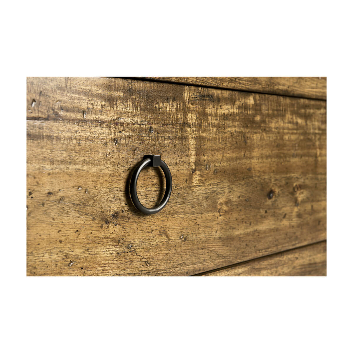 Close-up of drawer handle on wooden chest.