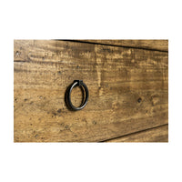 Close-up of drawer handle on wooden chest.