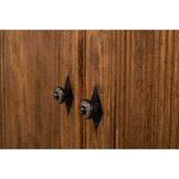 Close-up of handles on French country demilune cabinet.
