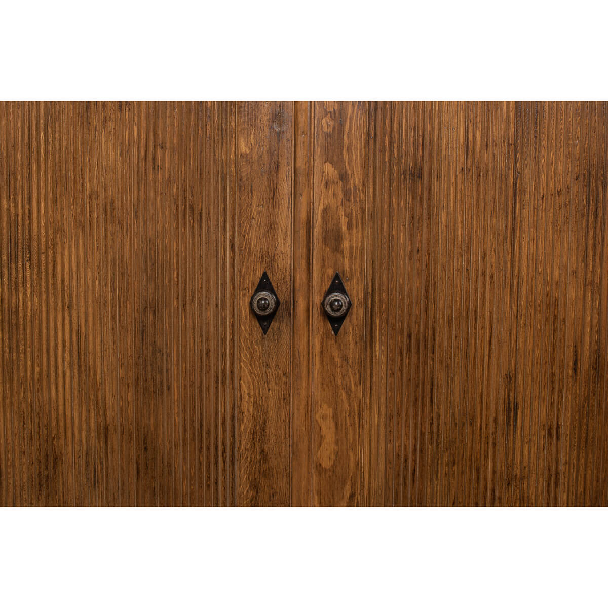 Close-up of French country cabinet door handles.