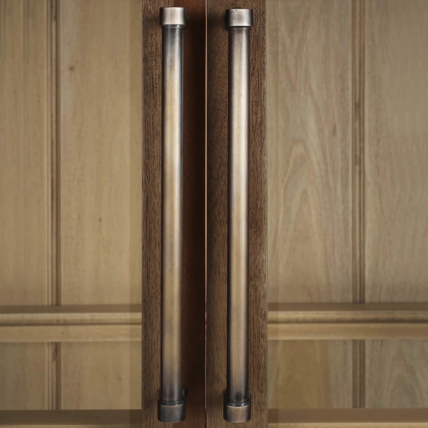 Detailed view of handle design on French country cabinet.