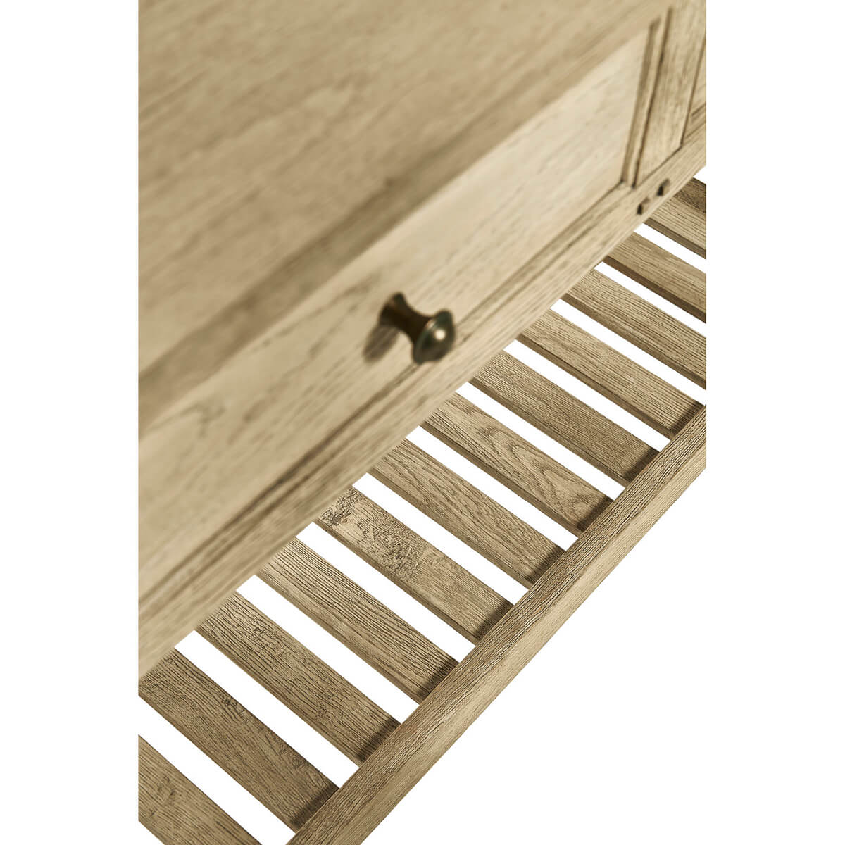 Slatted shelf of console table, open design, wood detail.