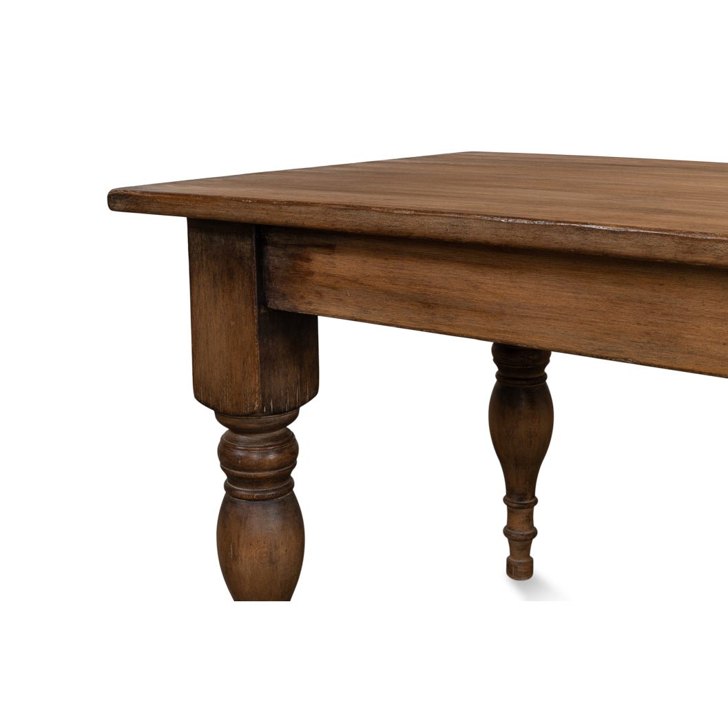 Detailed view of dining table turned leg and corner.