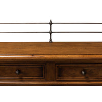Detailed top view of drawers and metal rail on buffet.