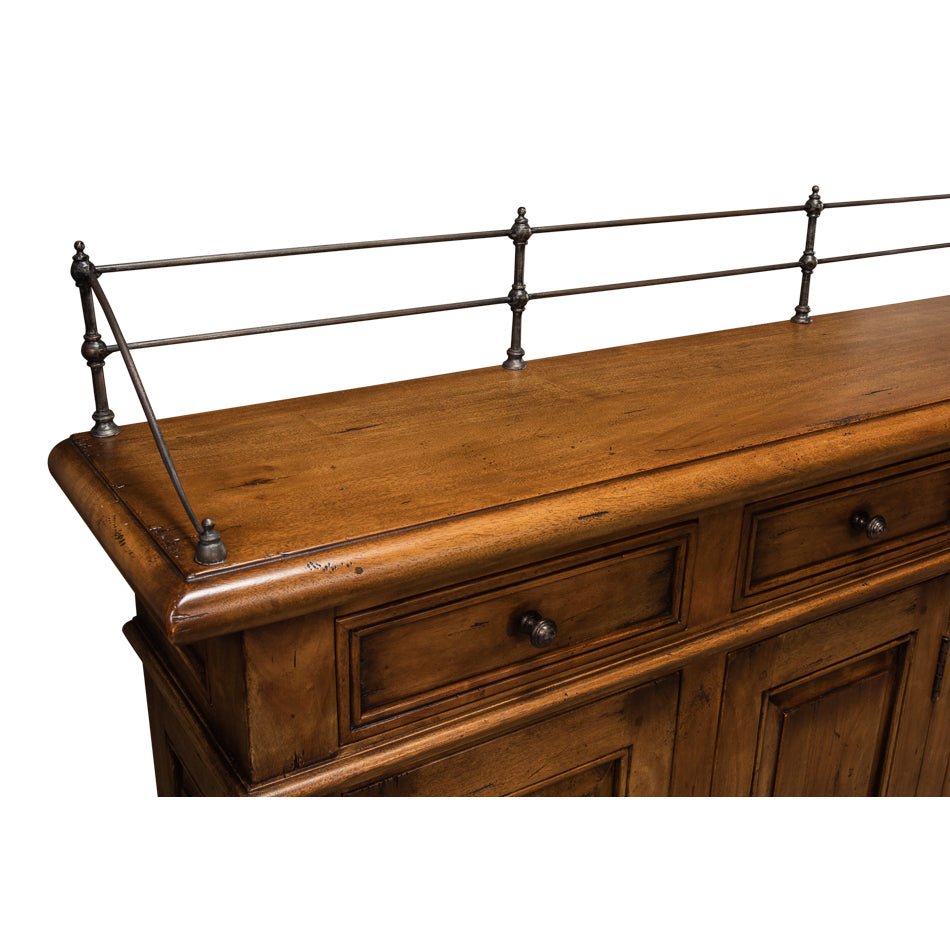 Close-up of metal rail detail on buffet sideboard.