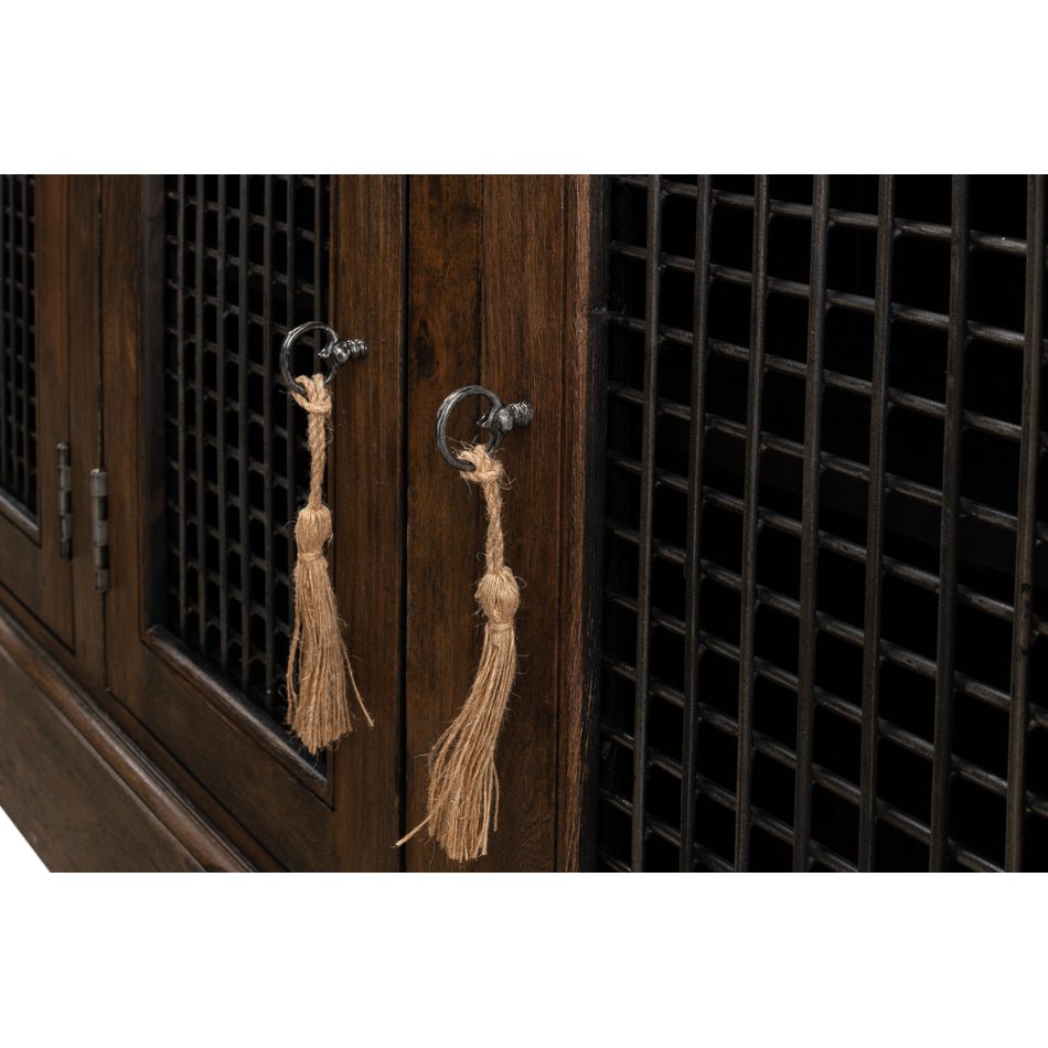 Close-up of tassel handles on buffet doors.